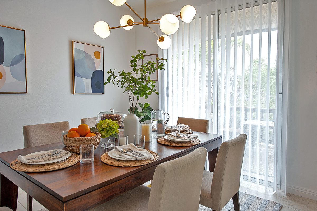 SmartDrape sheer vertical panels on a dining room slider